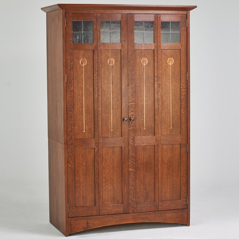 STICKLEY BY E.J. AUDI: Contemporary Harvey Ellis style media cabinet, Manlius, NY, 2006; Quatersawn oak, oak veneer, wood inlay, leaded glass, patinated metal; Meal tag and branded mark; 80 1/2" x 51" x 26"