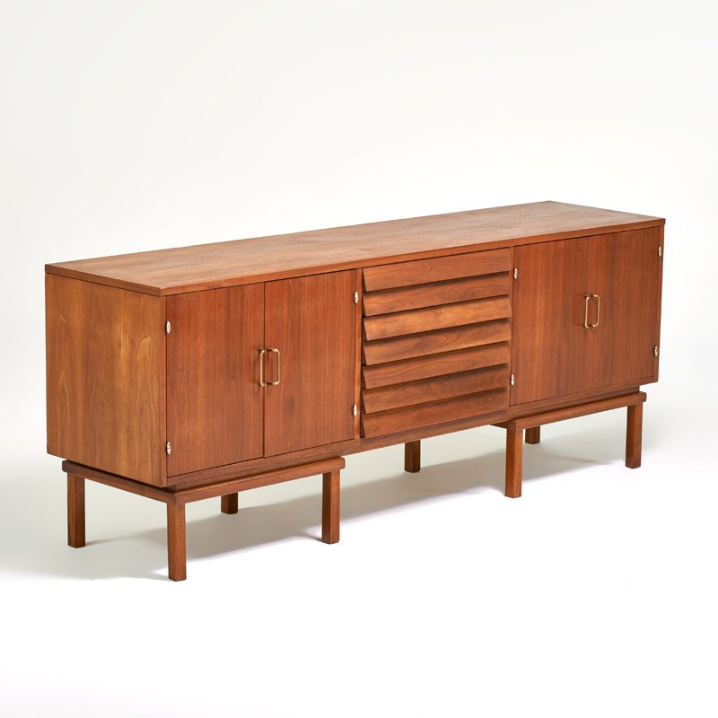 AMERICAN OF MARTINSVILLE: Long cabinet, USA, 1960s; Walnut, brass, chromed steel; Branded mark; 30 1/2" x 78 1/4" x 18 1/4"