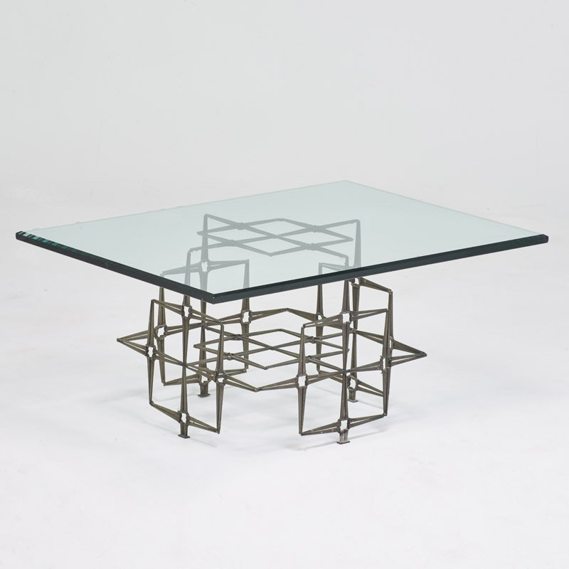 STYLE OF C. JERE: Coffee table, USA, ca. 1980; Beveled glass, patinated cut nails; Unmarked; 17" x 36" x 26"