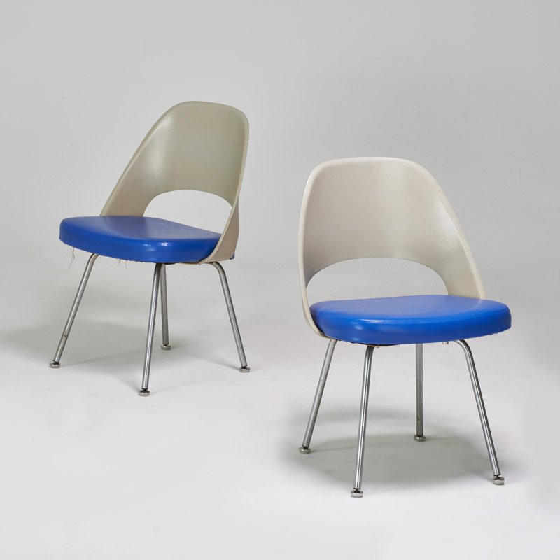 EERO SAARINEN: KNOLL ASSOCIATES: Pair of side chairs, New York, ca. 1970; Upholstery label to one; Molded fiberglass, vinyl, chromed steel; 32" x 21 1/2" x 18"