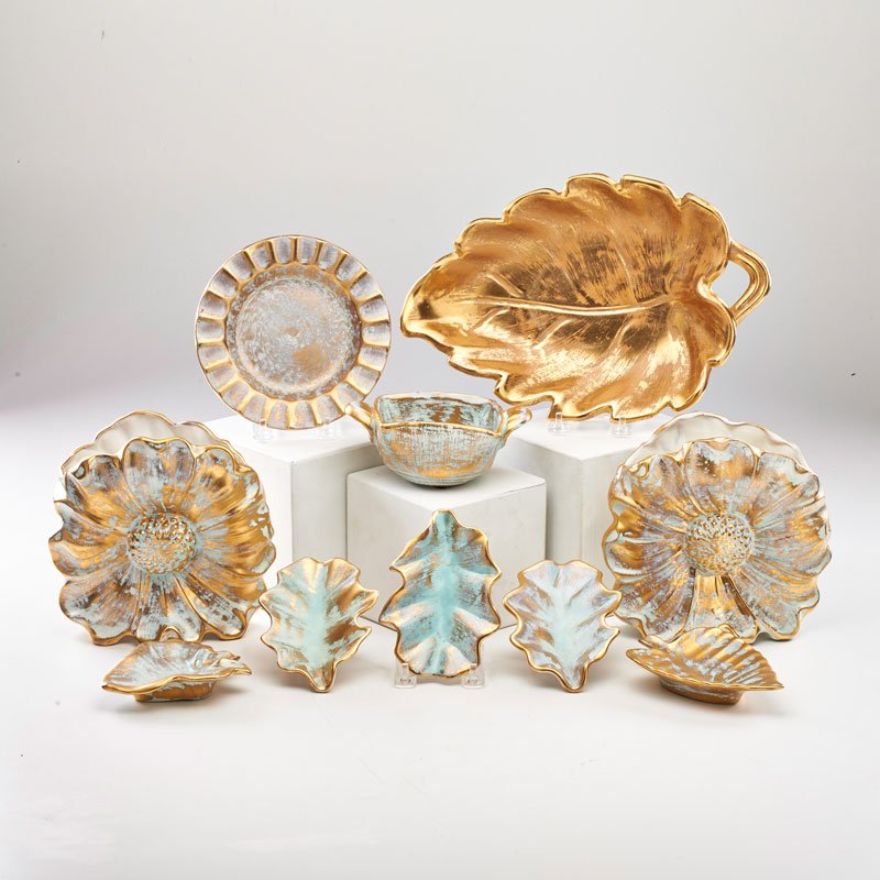 STANGL: Nine hand painted Antique Gold pieces: pair of pillow vases, two-handled bowl, five shallow dishes, plate, together with Granada Gold serveware, Trenton, NJ, 20th c.; All marked; Vase: 7 1/2" x 7 1/2"