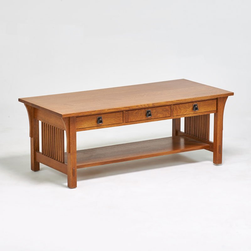 STICKLEY BY E.J. AUDI: Contemporary spindled three-drawer coffee table, Manlius, NY, ca. 1990; Quartersawn oak, copper-patined hardware; Metal tag and branded mark; 18" x 48" x 22"