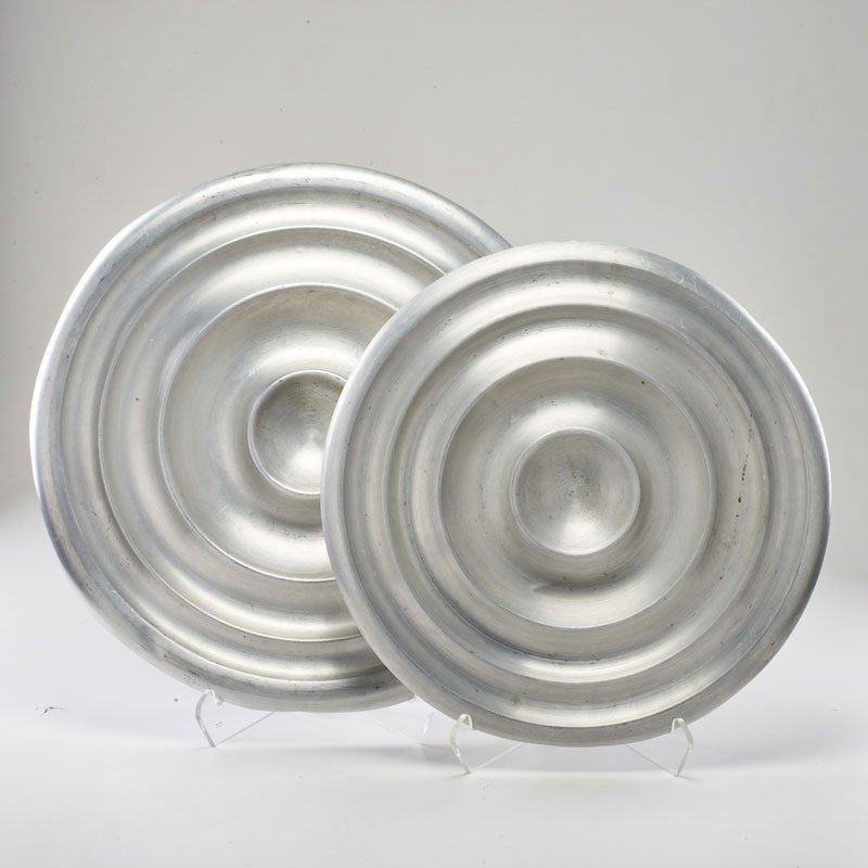 RUSSEL WRIGHT: Two concentric circle trays, USA, ca. 1930; Spun aluminum; Larger stamped; Larger: 21" dia.
