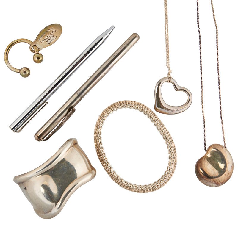 TIFFANY & CO. STERLING JEWELRY & ACCESSORIES: Comprising two pens; "Return to Tiffany" keychain; Elsa Peretti "Bean" necklace; Mesh bangle bracelet; Elsa Peretti open heart necklace; Elsa Peretti bone cuff bracelet. Stamped Tiffany & Co. Seven pi