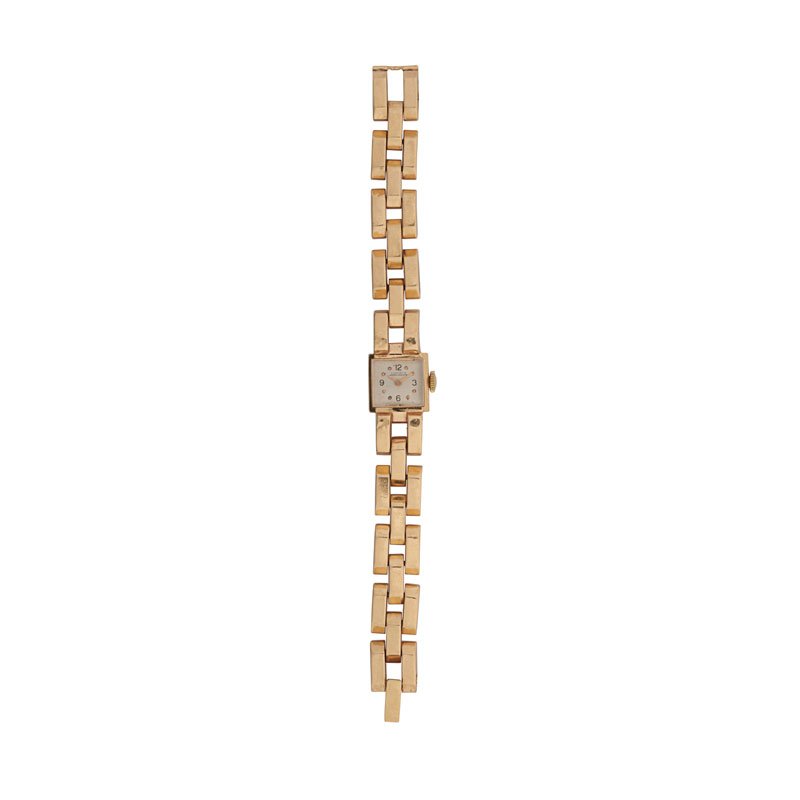 LADIES YELLOW GOLD BRICK LINK BRACELET WATCH: With Bucherer, Swiss, 17 jeweled movement, square case, on chamfered brick link bracelet, 14k, ca. 1945. Branded for Ludwig Jewelers. 6" x 1/2". 17.6 dwt.
