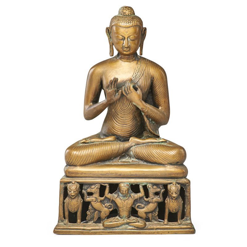 CHINESE BRONZE BUDDHA: Seated in lotus position on pierced base with foo dogs and figure, China, 19th/20th c.; Unmarked; 15" x 9" x 6 1/2"