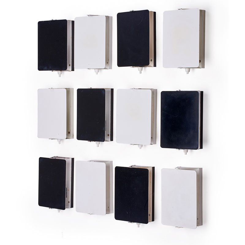 CHARLOTTE PERRIAND Twelve sconces: CHARLOTTE PERRIAND (1903 - 1999) GALERIE STEPH SIMON Twelve sconces, France, des. 1960 Enameled steel, plastic, single sockets Foil labels to most 7" x 5" x 2 3/4" ea. Literature: Charlotte Perriand: 