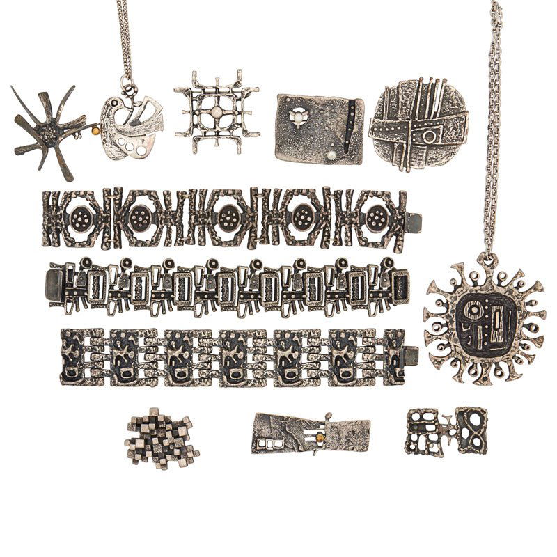 12 PIECES GUY VIDAL ARTISANAL JEWELRY: Comprising three conforming link bracelets; One sun motif and one bird pendant; Seven brooches, one with "pearl" accents. Ten stamped with artist's name or cypher. Bracelets 8", larger pendant 3" dia.