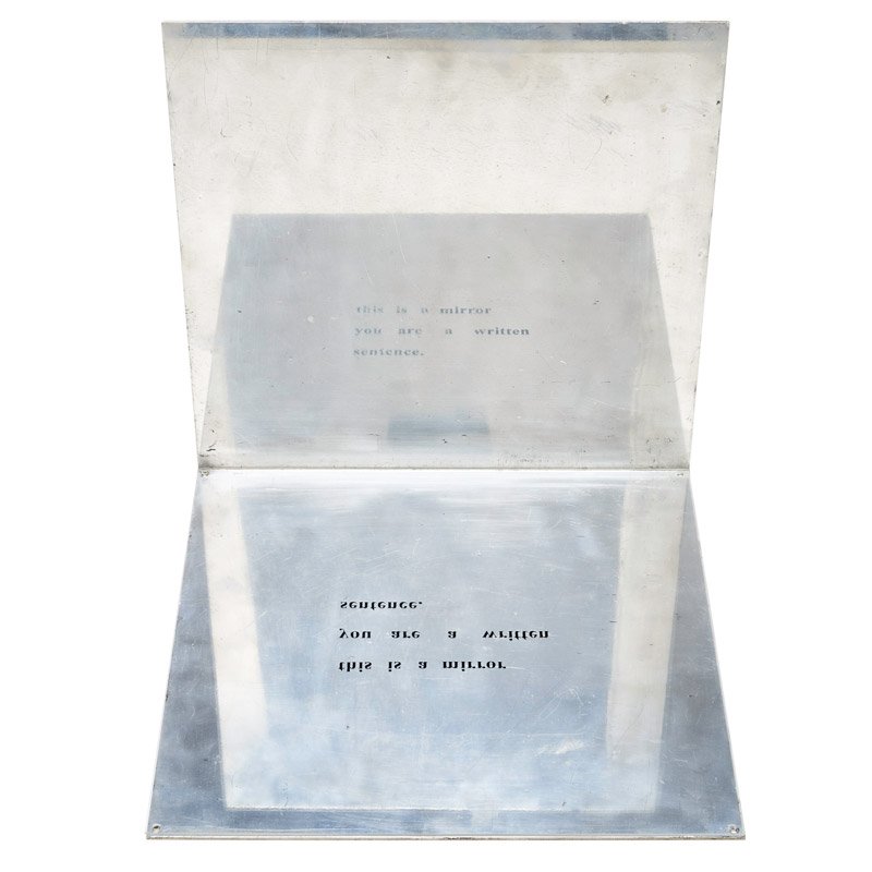 LUIS CAMNITZER (Uruguayan, b. 1937): Polished aluminum and plexiglass; "This is a Mirror, You are a Written Sentence," 1967; Etched signature, date and illegible edition number; 12" x 12" x 12"