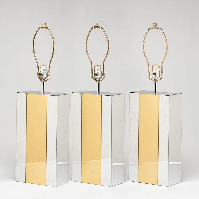 ROBERT SONNEMAN: Set of three chromed steel and brass columnar table lamps, USA, 1970s; Sticker label; Each: 26 3/4" x 8" x 4"