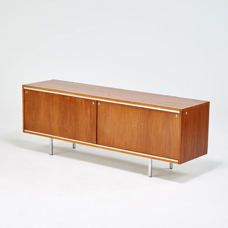 GEORGE NELSON; HERMAN MILLER: Sliding door cabinet, Zealand, MI, 1960s; Chromed steel, polished aluminum, walnut; Unmarked; 27" x 74 1/2" x 19"