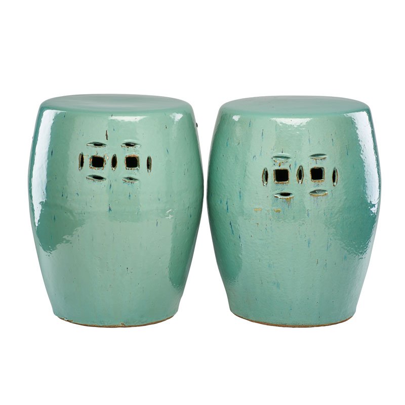PAIR OF CELADON PORCELAIN GARDEN SEATS: Barrel form with simple pierced geometric decoration on two sides, 20th c.; 17" x 12"