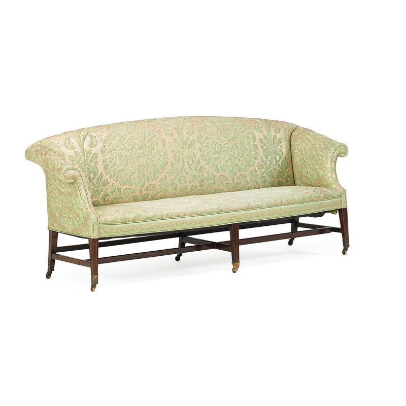 GEORGE III MAHOGANY SETTEE: Scrolled arms on four carved legs, upholstered with Fortuny silk and silk-screened fabric, England, 18th/19 c.; 32" x 81 1/2" x 23"