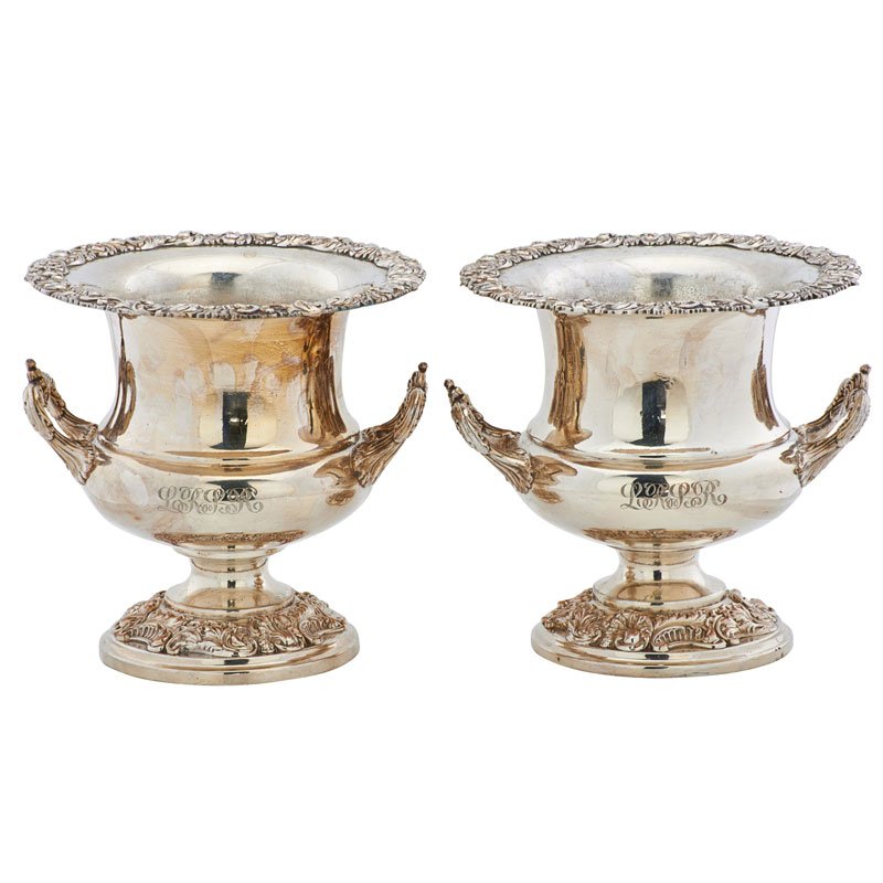 PAIR OF SILVER PLATED WINE COOLERS: Each urn form with foliate decorated edges and monogrammed, 19th/20th c.; 10" x 10"