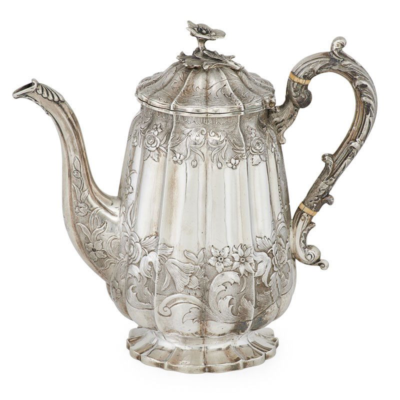 WILLIAM IV SILVER COFFEE POT: Retailed by I & T Turner, lobed body, handle and hinged dome cover chased with scrolling foliage, floral finial and monogram to spout, London, England, 1836-37; Marked, makers Joseph and John Angell;