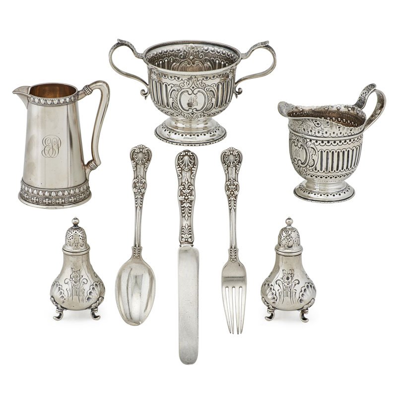 TIFFANY & CO. STERLING SILVER: Eight: Child's flatware set in English King pattern, two footed salt and pepper shakers with shell and floral decoration, a creamer and sugar bowl, and a creamer/miniature pitcher, U.S.A., late 19th/e