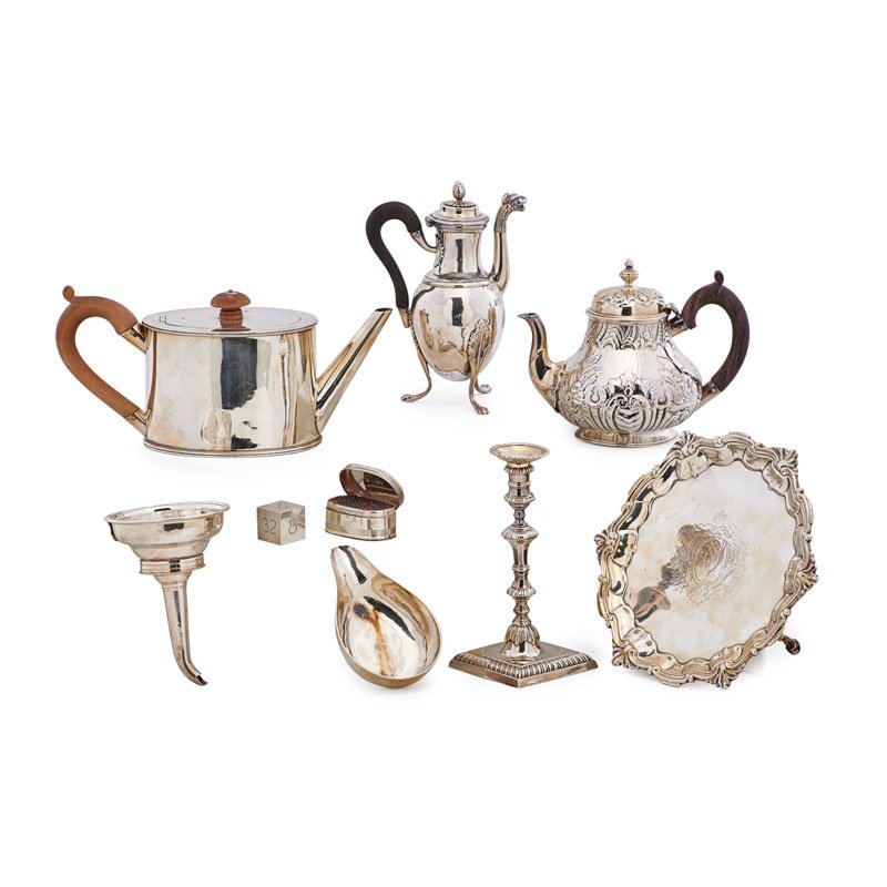 SILVER GROUPING: Nine: Tiffany & Co. sterling silver doubling cube, Elizabeth Cooke candlestick, wine funnel, footed sterling salver, sterling nutmeg grinder, Frederick Brasted sterling teapot, French sterling chocola