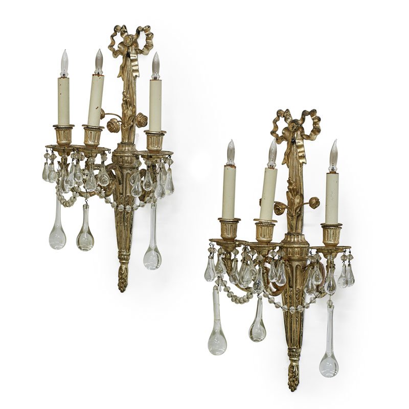 PAIR OF LOUIS XVI STYLE SCONCES: Each three-light silvered metal with ribbon detail at top and glass prisms, France, early 20th c.; 20 3/4" x 11"