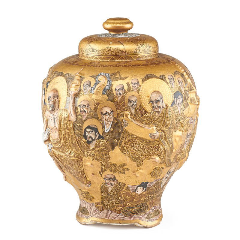SATSUMA PORCELAIN LIDDED URN: Decorated with figural scenes in bas relief, Japan, late 19th c.; Marked; 13" x 9 1/2"