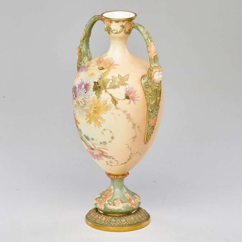ROYAL WORCESTER: Porcelain urn with sculptural handles and painted floral decoration, England, early 20th c.; Stamped and numbered; 14 1/4" x 7 1/2" x 6 1/2"