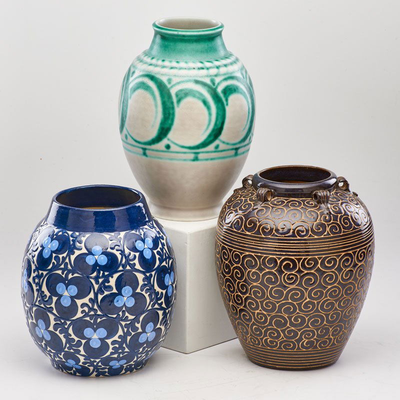 EMILE LENOBLE (1875 - 1940); ROYAL LANCASTRIAN; ME: Three ovoid vases: one with incised swirls, one with stylized foliate decoration, and one with geometric design and flared rim, France/ England/ Germany, early 20th c.; Glazed ceramic; All marked; Tal