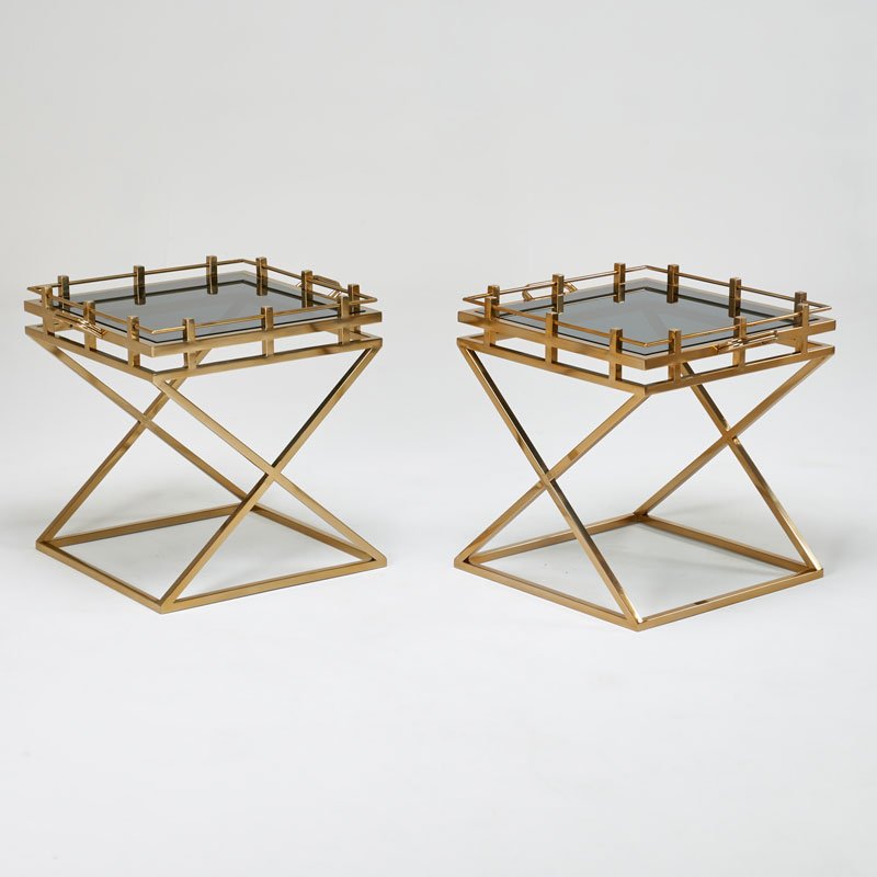 CONTEMPORARY: Pair of x-frame side tables, 2000s; Patinated brass, smoked glass; Unmarked; 25 1/2" x 27 1/2" x 23 1/2"