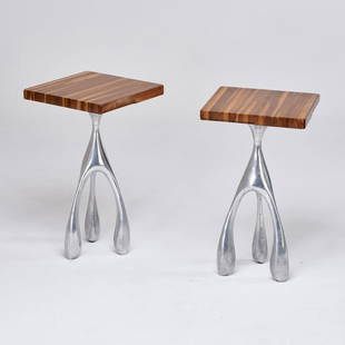 JORDAN MOZER; RENAISSANCE TIMES SQUARE: Pair of tall side tables, Chicago, IL, 2006; Cast and polished aluminum, laminated walnut; Manufacturer labels; 31" x 17 3/4" sq.