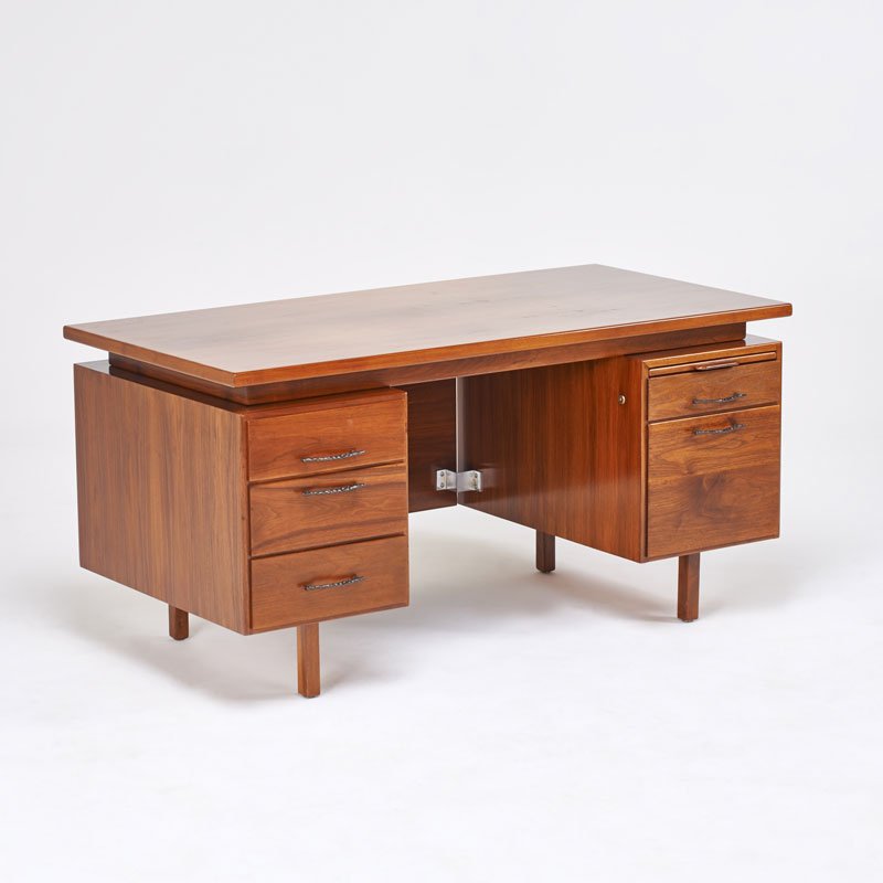 JENS RISOM: Double pedestal desk, USA, 1960s; Walnut, patinated brass; Unmarked; 30" x 60" x 30"