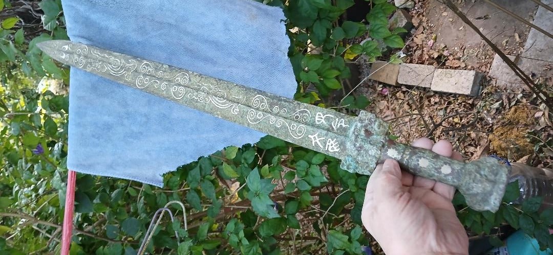 Important 3500-years-old Sanxingdui Period Bronze Sword: This bronze sword came from the Sanxingdui period with inscriptions. It has four Chinese characters with silver inlay. This is probably one of the oldest bronze swords from China.