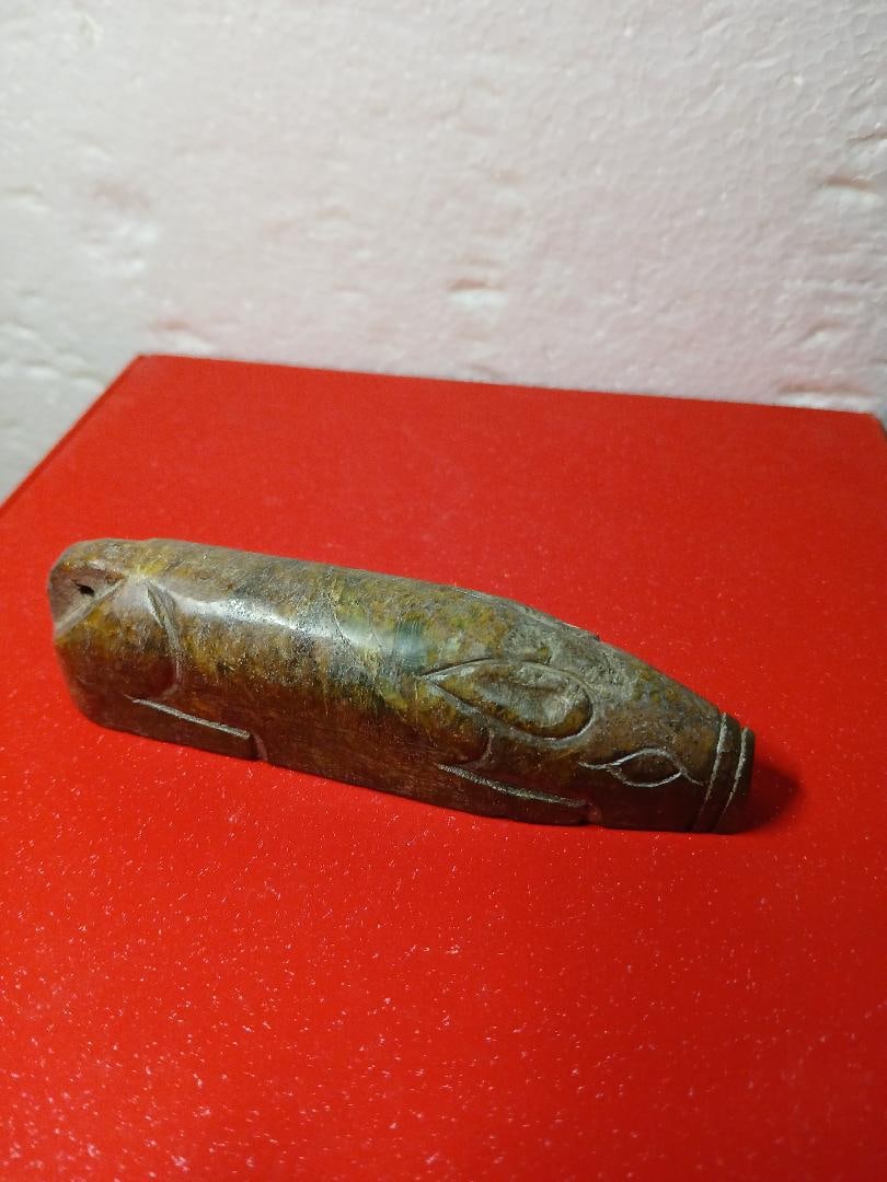 Elegant Han Dynasty Spinach Green Jade Carving of Pig: This is an elegant spinach green jade carving of a pig. The carving technique is simple yet elegant. The spinach jade is the top-grade for carving.