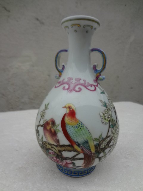 Elegant 20th Century Enamel Pheasant Vase: H 6 1/8 in. This is an elegant copy of the famous Qianlong Period pheasant vase which was sold over one million dollars. The vase is decorated with two beautiful pheasants sitting on a tree. The paint