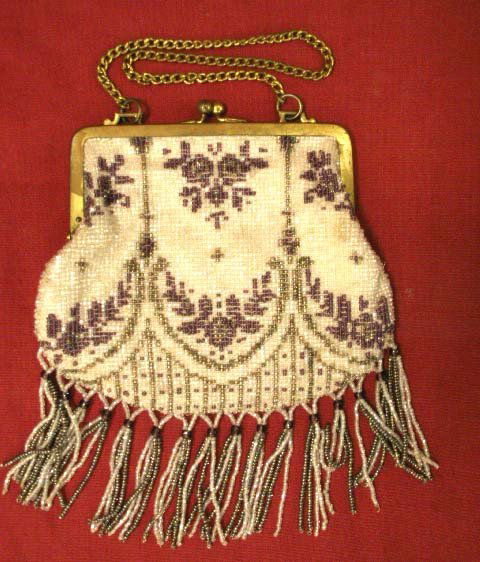 VINTAGE GLASS BEADED HAND BAG WITH FRINGE: VINTAGE GLASS BEADED HAND BAG WITH FRINGE (NEW CHAIN, DISCOLORATION ON FRAME). BAG 5 X 6""