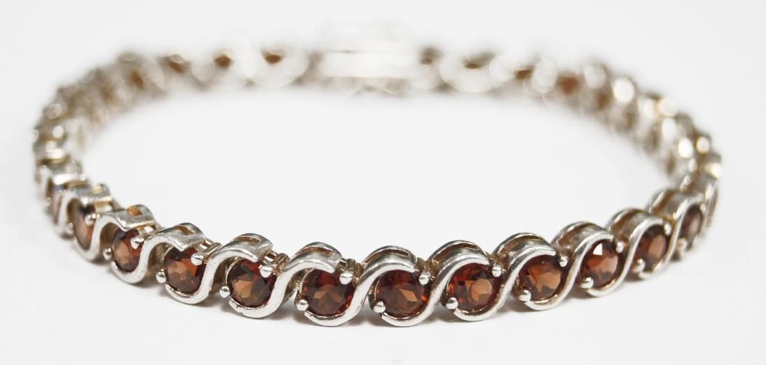 925 STERLING AND GARNET LINE BRACELET. LENGTH 7 1/4"; (1 of 1)