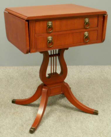 PAIR PHYFE STYLE DROP-LEAF, 2-DRAWER WORK TABLES: PAIR PHYFE STYLE MAHOGANY DROP-LEAF, 2-DRAWER WORK TABLES. HEIGHT 26; WIDTH 19" **DUE TO SIZE AND OR FRAGILITY OF THIS LOT IN-HOUSE SHIPPING IS NOT AVAILABLE** "