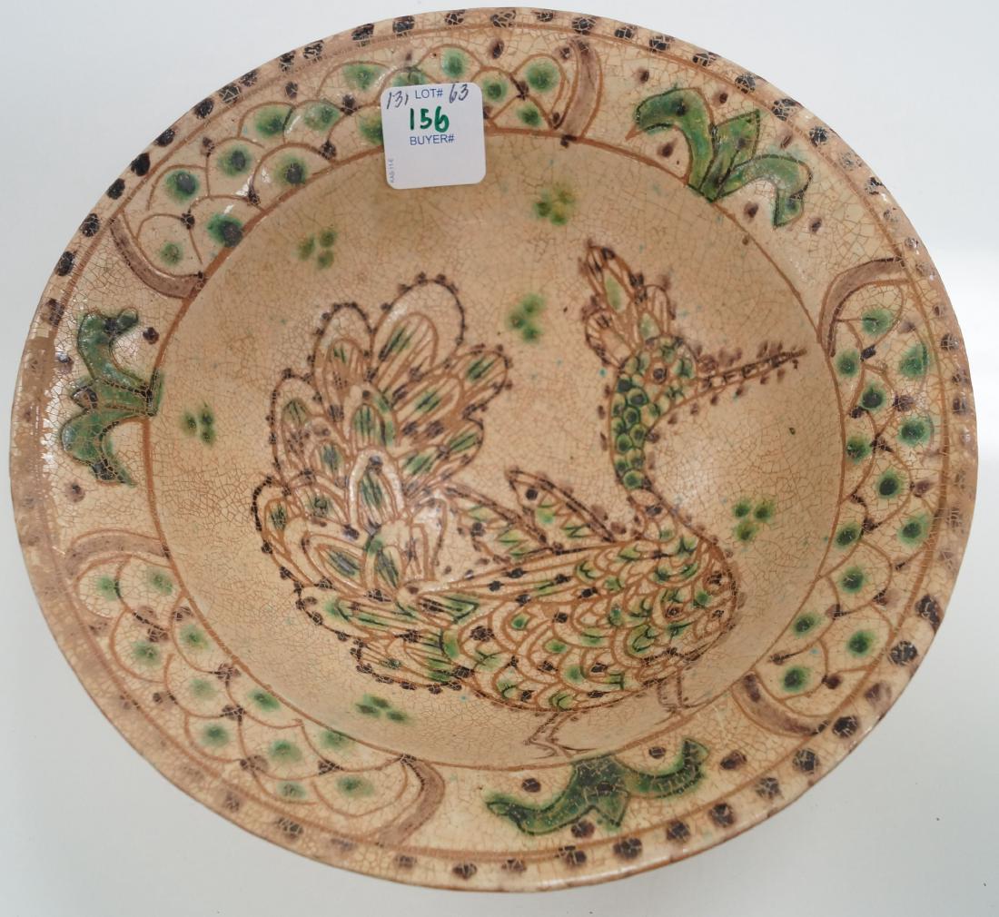 ISLAMIC DECORATED POTTERY BOWL WITH PEACOCK. HEIGHT 3";: ISLAMIC DECORATED POTTERY BOWL WITH PEACOCK. HEIGHT 3"; DIAMETER 8 1/2"