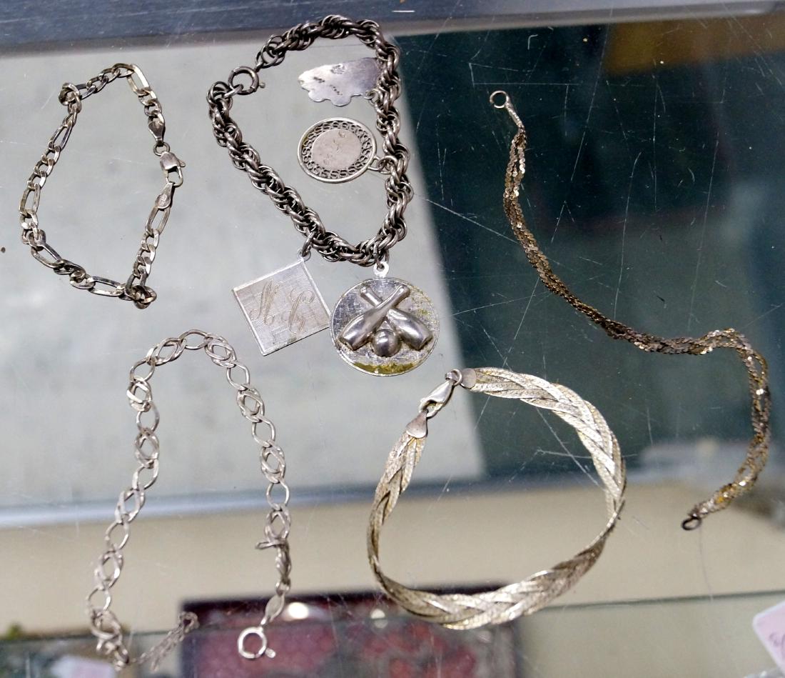 LOT (5) STERLING BRACELETS INCLUDING CHARM BRACELET. (1 of 1)