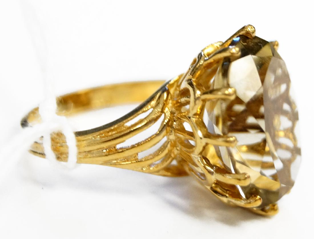 14K YELLOW GOLD AND 9.5 CT OVAL-CUT CITRINE RING. RING: 14K YELLOW GOLD AND 9.5 CT OVAL-CUT CITRINE RING. RING SIZE 6 1/2; GROSS WEIGHT 7.3 GRAMS