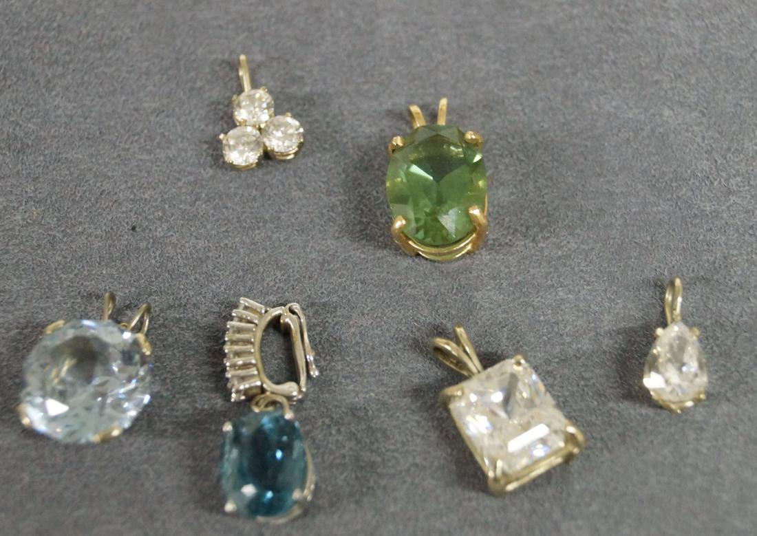 WHITE AND YELLOW GOLD (TESTS 14K) FRAMED BLUE AND WHITE: WHITE AND YELLOW GOLD (TESTS 14K) FRAMED BLUE AND WHITE TOPAZ EARRING AND PENDANTS INCLUDING BERYL, CZ, ETC. GROSS WEIGHT 21.5 GRAMS