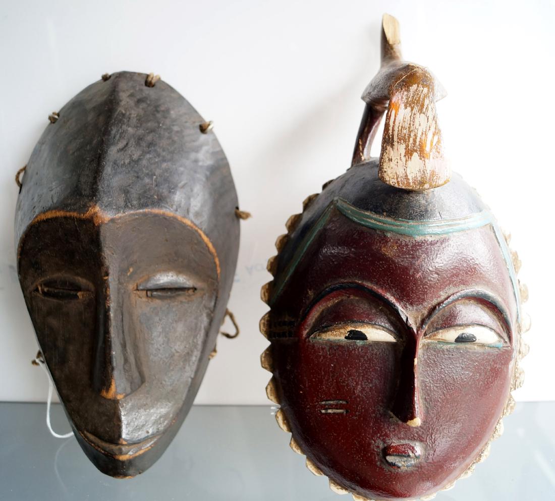 LOT (2) CARVED MASKS INCLUDING BAULE, IVORY COAST,: LOT (2) CARVED MASKS INCLUDING BAULE, IVORY COAST, HEIGHT 12" (IMPERFECTIONS) AND CENTRAL AFRICAN, HEIGHT 10 3/4"
