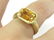 750 BURNISHED YELLOW GOLD AND EMERALD-CUT CITRINE RING.