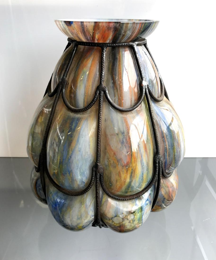 BLOWN OUT ART GLASS VASE WITH WROUGHT IRON MOUNT. (1 of 2)
