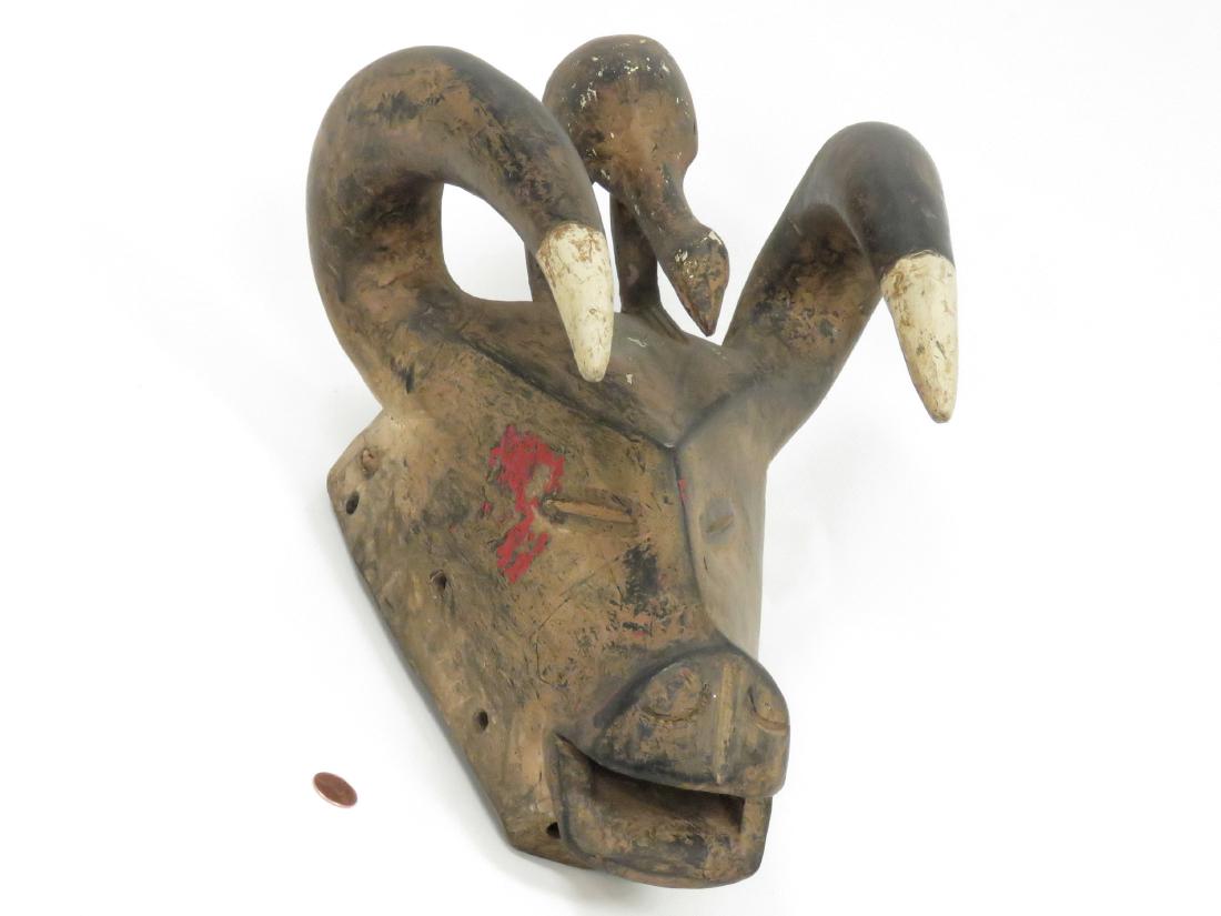 SENUFO, IVORY COAST, CARVED AND PAINTED BUFFALO MASK. (1 of 4)