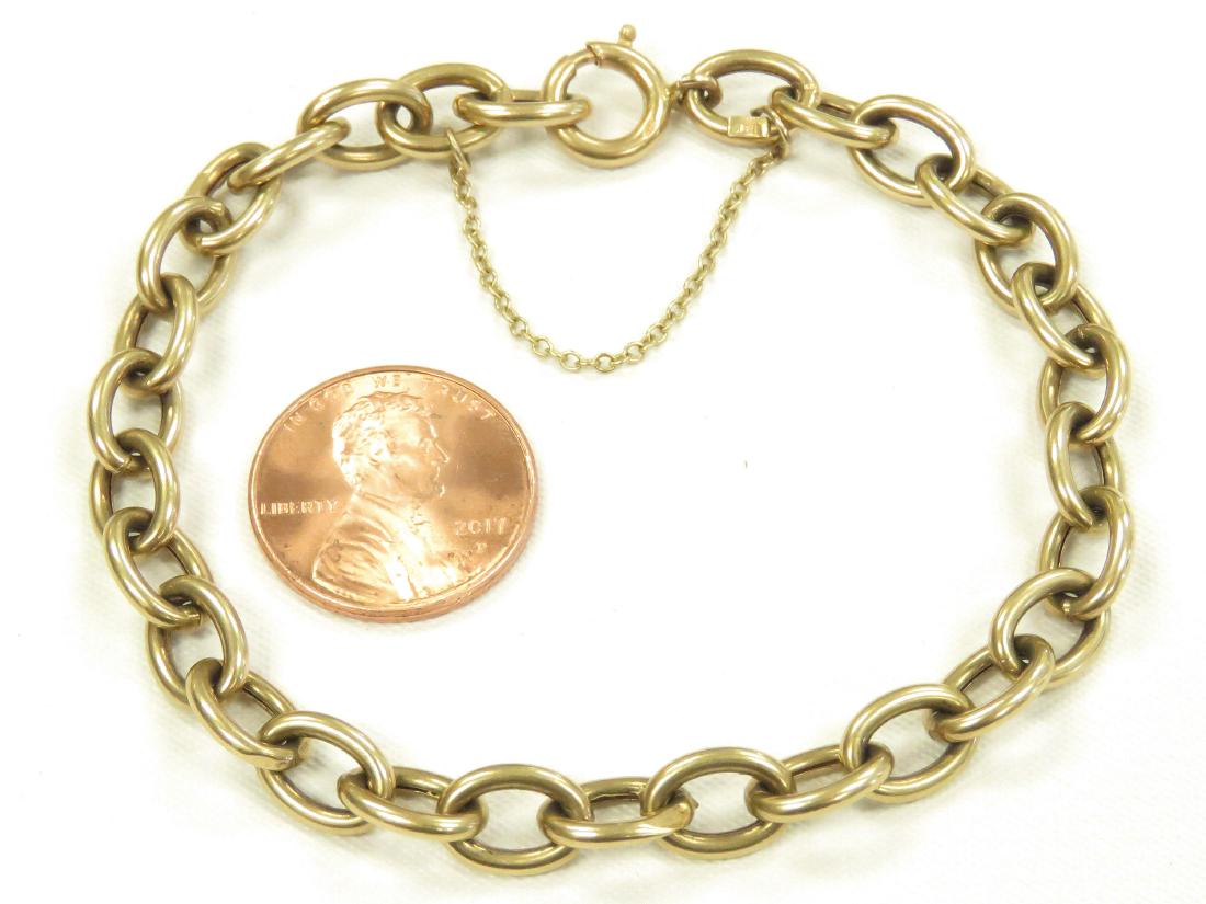 750 YELLOW GOLD LINK CHARM BRACELET WITH SAFETY CHAIN.: 750 YELLOW GOLD LINK CHARM BRACELET WITH SAFETY CHAIN. LENGTH 7"; 7.28 GRAMS