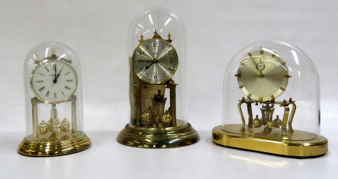 LOT (3) BRASS ROTARY DOME CLOCKS INCLUDING SHATZ,: LOT (3) BRASS ROTARY DOME CLOCKS INCLUDING SHATZ, HOWARD MILLER & KUNDE