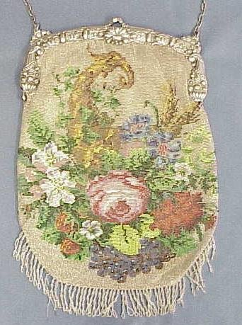 FINE GERMAN VINTAGE BEADED HAND BAG: FINE GERMAN VINTAGE BEADED HAND BAG WITH .800 SILVER FRAME WITH LEATHER LINING, 19/20TH CENTURY. 12 X 8 1/2" (2/STRINGS OF BEADS ON FRINGE NEED REPAIR; MINOR BEAD LOOSE NEED FRAME HINGE)