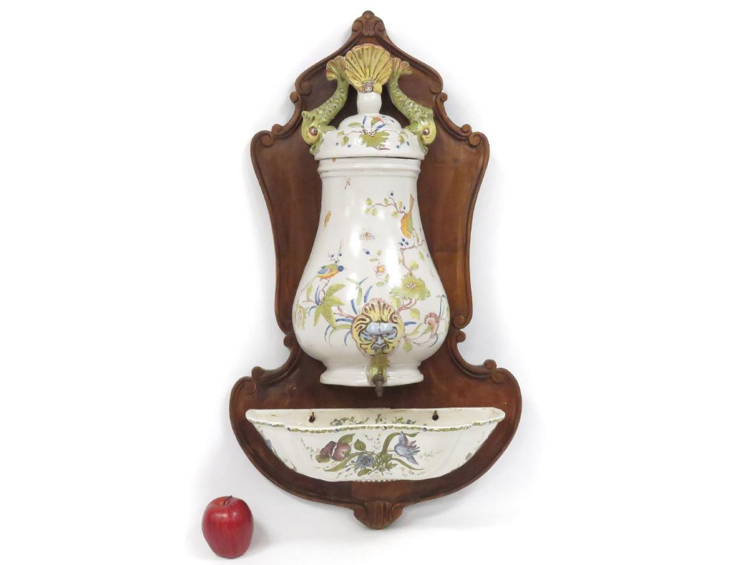 ITALIAN FAIENCE GLAZE POTTERY LAVA BOW, MOUNTED ON: ITALIAN FAIENCE GLAZE POTTERY LAVA BOW, MOUNTED ON CARVED FRUITWOOD PANEL, SIGNED. HEIGHT 32" (REPAIR)