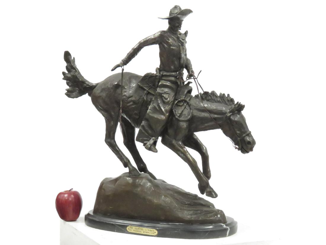 AFTER FREDERICK REMINGTON), BRONZE, "THE ARIZONA: AFTER FREDERICK REMINGTON), BRONZE, "THE ARIZONA COWBOY". HEIGHT 24"