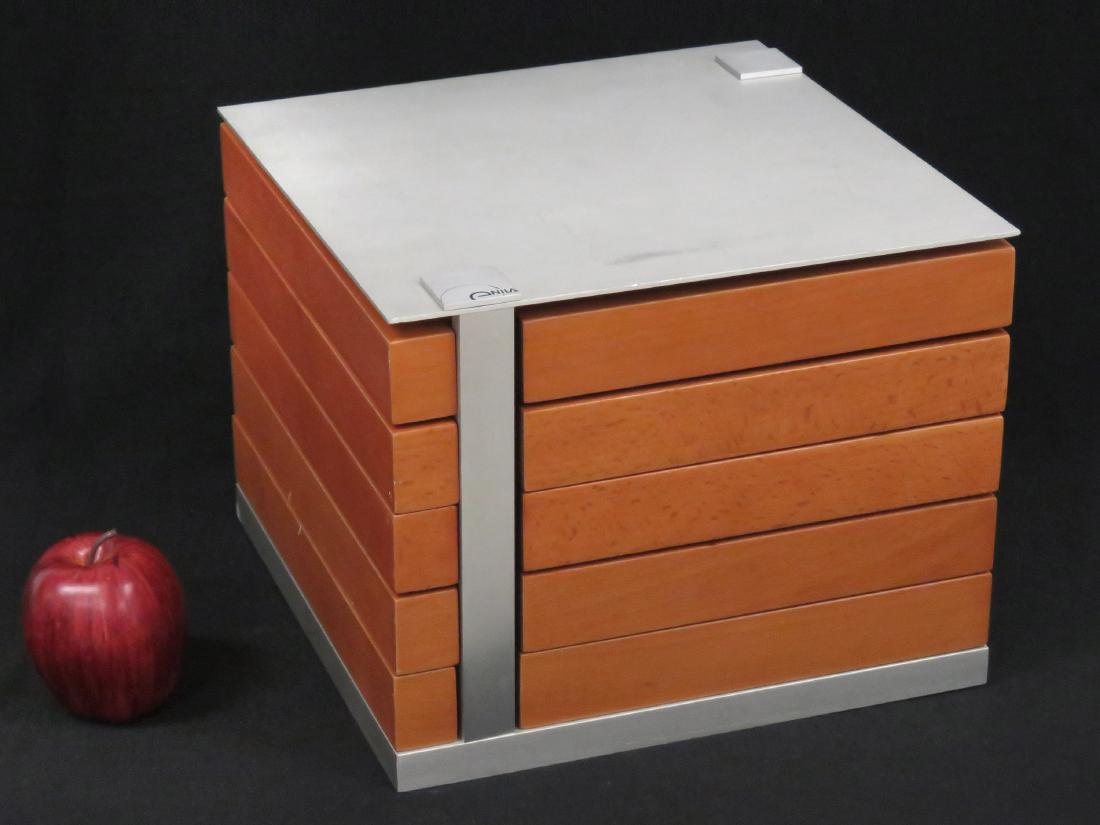 ENILA WATCHES ALUMINUM/BIRCH WATCH CABINET, SIGNED.: ENILA WATCHES ALUMINUM/BIRCH WATCH CABINET, SIGNED. HEIGHT 9 1/2"; TOP 12 X 12"