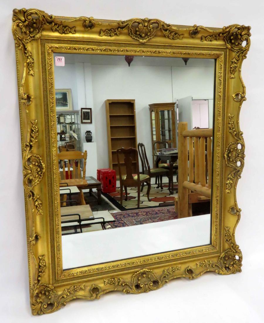 FRENCH STYLE CARVED AND GILT FRAMED MIRROR. 34 X 28" (1 of 1)