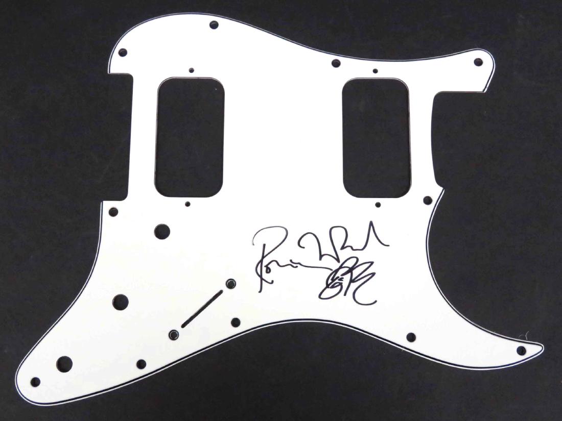 RONNIE WOOD (BRITISH ROCKER-ROLLING STONES 1947-),: RONNIE WOOD (BRITISH ROCKER-ROLLING STONES 1947-), BLACK MARKER SIGNED GUITAR SCRATCH PLATE. 9 X 11"